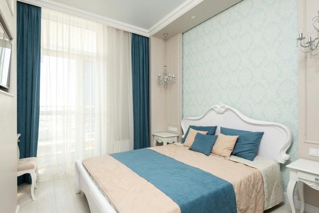 modern bedroom with bed near window