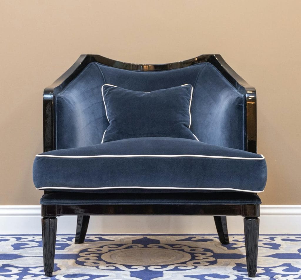 dark blue chair wrapped with suede material